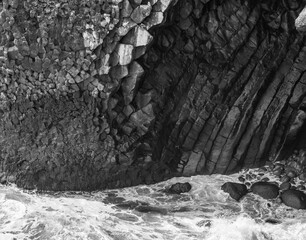 surf on basalt rocks in atlantic ocean in Iceland
