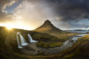 wide angle picture of Kirkjufellsfoss with the Kirkjufell (church mountain) in the background. On the northern coast of Snaefellsnes peninsula in Iceland.