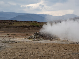 mountains and geysers in Hverir in Iceland