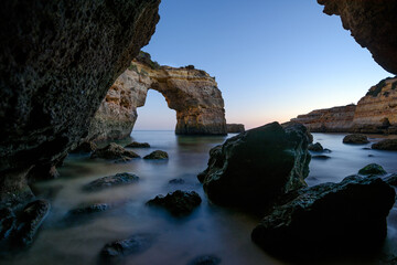 Arch at Praia Albandeira at the Algarve coast in southern Portugal. Long exposure after sunset.