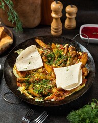 Delicious spiced chicken served with golden fries and flatbread at a cozy restaurant setting