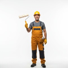 Fototapeta premium Construction worker holding paint roller and smiling in uniform 
