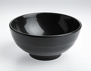 Black empty ceramic dip bowl close up. Isolated over white background