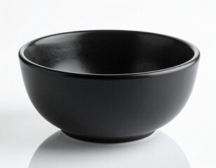 Black empty ceramic dip bowl close up. Isolated over white background