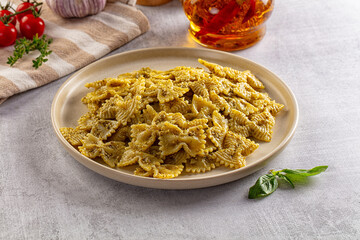Italian green pasta farfalle with pesto