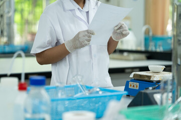 Medical Student Conducting Lab Experiment with Glassware