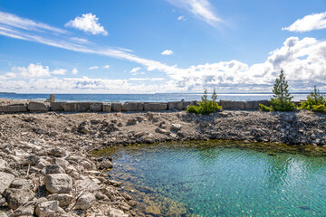 Flowerpot Island's clear waters and rugged shores offer a tranquil escape in Ontario's Bruce Peninsula.
