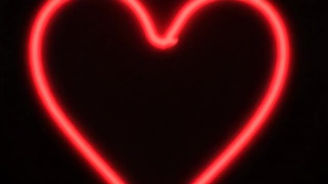 Red neon heart shine line. Particle line forming a neon heart shape. Heart motion. Empty space on the middle and black background.
