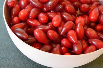 Freshly picked dogwood in a bowl, close-up.