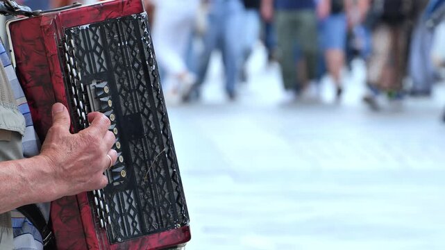 Street musician playing accordion on a Moscow street