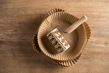 Baking tools and materials arranged neatly on a wooden surface for creative cake decorating