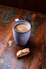 Cup of coffee on rustic wooden background. Soft focus. Copy space	