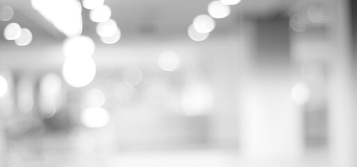 Blur white abstract background, blurred grey gradient bright light with copy space backdrop, banner, blank mordern business office interior hallway building design background, monochrome