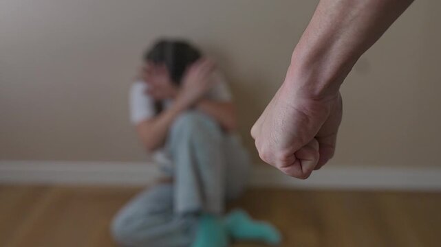 Child sits quietly in corner. Pain visible in girl face. Trauma, fear, and abuse reflected in posture. Girl avoids eye contact. Trauma repeats through fear. Abuse pain trauma and girl dominate moment