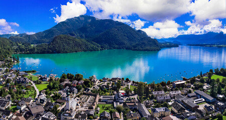 Austria tourism and most scenic places. wonderful turquoise lake Wofgangsee (Wolfgang) and beautiful village Sankt Gilgen surrounded by alps mountains austrian travel in Salzkammergut