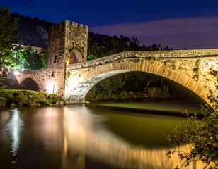 Ancient stone bridge at night