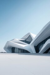 Modern architectural structure with angular white design under clear blue sky