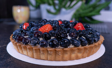 Blueberry cake covered with sugar glaze