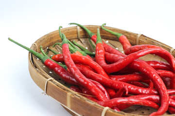 bunch of fresh hot chilies isolated on white background. In Indonesia it is usually called Cabai Merah Keritng. The main ingredient in every spicy dish or dish, for example chili sauce