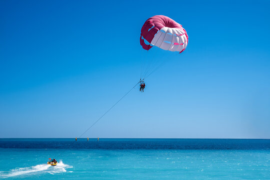 Parasailing over the blue sea of Bay of Angels in Nice, France