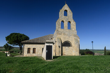 Fototapeta premium Stone facade of San Juan de Jerusalen hospital in Tamara de Campos, Palencia, with bell gable