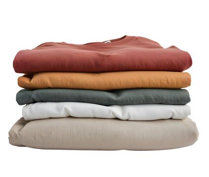 Neatly folded minimalist cotton tshirts in earth tone colors isolated on the transparent background for fashion and organization concepts