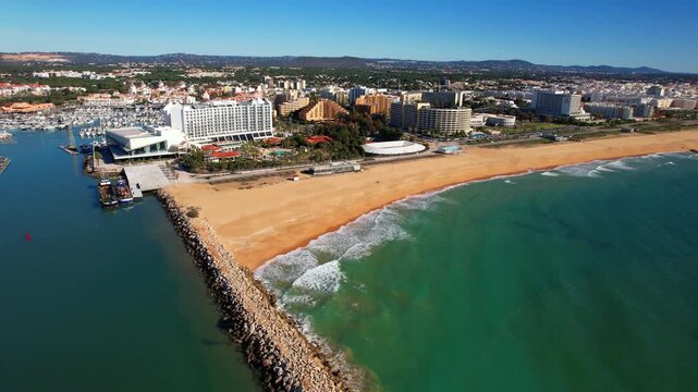 Vilamoura luxury trendy resort in the Algarve region of southern Portugal. aerial drone 4k hd footage of marina and ong sandy beach