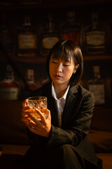 Closeup businessmen holding a glass of whiskey