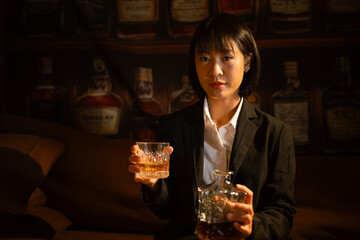 Closeup businessmen holding a glass of whiskey