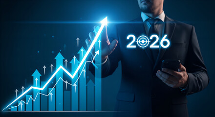 Businessman analyzes upward trending financial graph and target year 2026 on futuristic interface