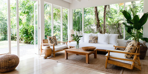 Fototapeta premium Tropical living room with lush greenery