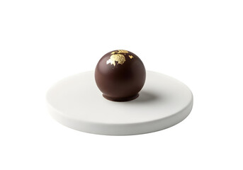 Chocolate truffle with gold leaf isolated on transparent background, a decadent treat on a white plate, perfect for a dessert or gift, close up shot