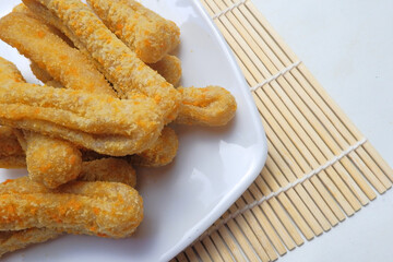 crispy golden brown fried dough sticks on plate