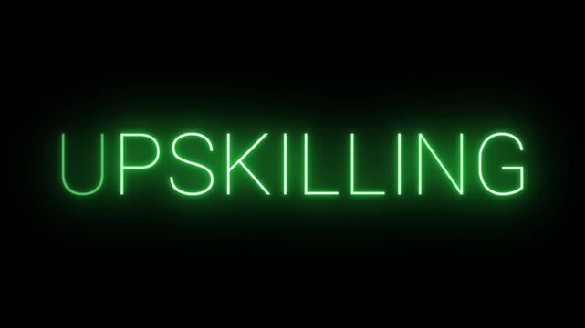 Flickering neon green Upskilling sign animated on black background.
