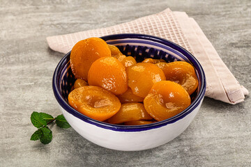 Sweet canned apricots with syrope