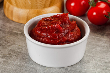 Red tomato paste in the bowl