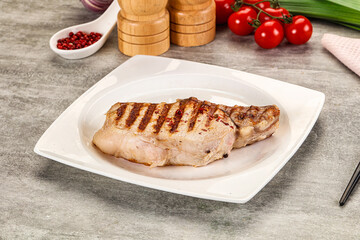 Grilled pork loin steak with bone