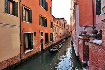 Many gondolas passing through the canal in the San Marco district of Venice, Italy