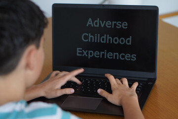 adverse childhood experiences. text written on a teenager's laptop screen