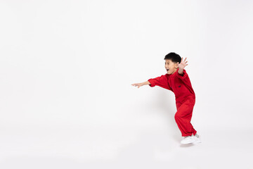 Asian little boy in red body suit running isolated on white background, Full body composition and six years old