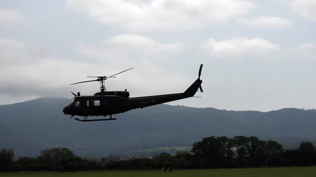 The legendary American military helicopter UH-1 in the clouds