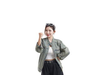 Confident Woman Expressing Success: A stylish young woman stands tall, radiating confidence and joy as she celebrates a personal or professional triumph. She embodies the spirit of achievement.