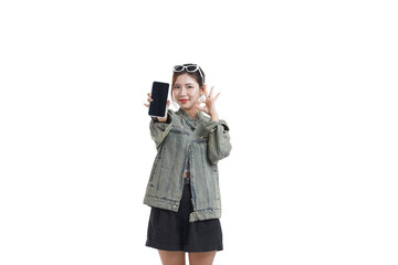 Young Woman Showcasing Phone: A stylish young woman, radiating confidence and charm, enthusiastically presents her phone screen, suggesting the myriad possibilities it holds. 