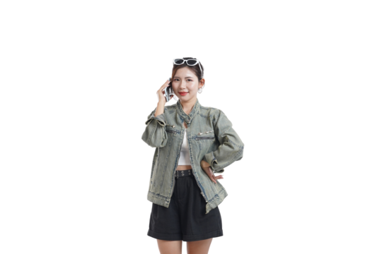 The Casual Conversation: A poised woman, illuminated by natural light, engages in a mobile phone call, showcasing her confidence in a moment of everyday connection.