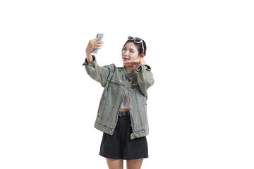 Selfie with a Smile: A stylish individual, radiating positivity, captures a selfie with a mobile phone, embodying the essence of modern connection and joyful self-expression.