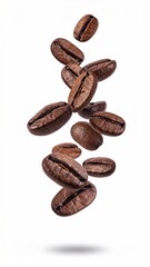 Obraz premium Roasted coffee beans in mid-air, falling