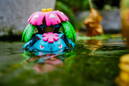September 21 2025 - Figure Venusaur Pokemon - Toy Photography -enjoying amidst a lush forest with a beautiful waterfall behind