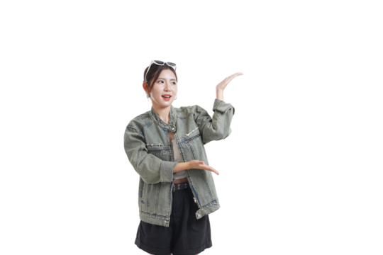 Enthusiastic Gesture: A stylish individual stands poised against a minimalistic backdrop, presenting or indicating with open hands, embodying a sense of excitement, allure, and persuasive charm.