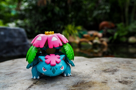 September 21 2025 - Figure Venusaur Pokemon - Toy Photography -enjoying amidst a lush forest with a beautiful waterfall behind