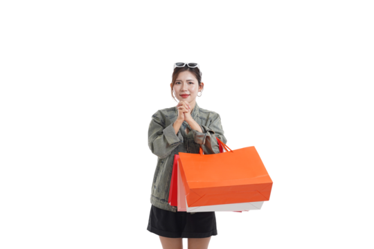 Shopping Spree Delights: A woman, elated after a successful shopping day, clutches vibrant shopping bags in her hands, embodying the excitement of retail therapy.